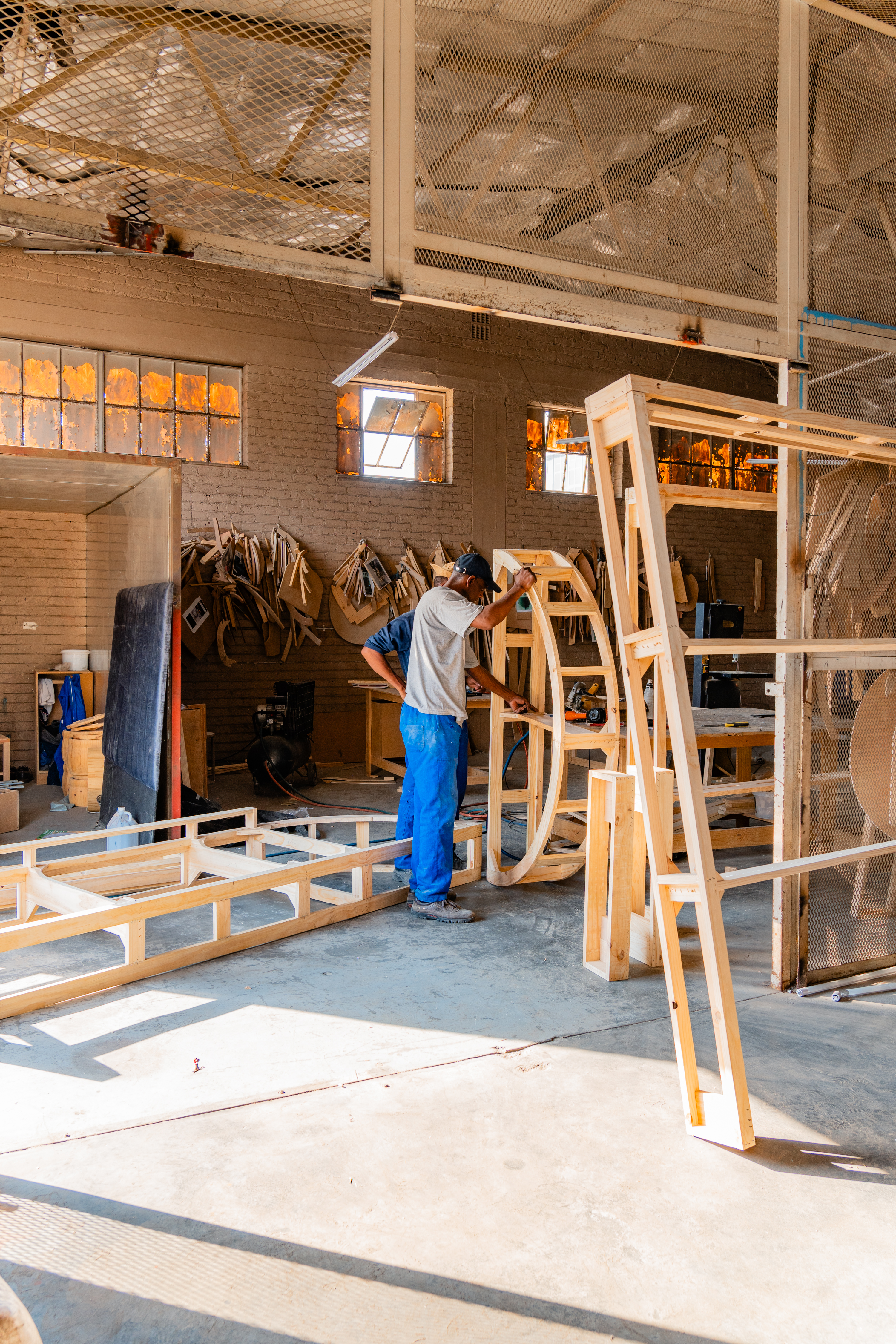 CloudHaus craftsperson preparing timber furniture frames in the workshop